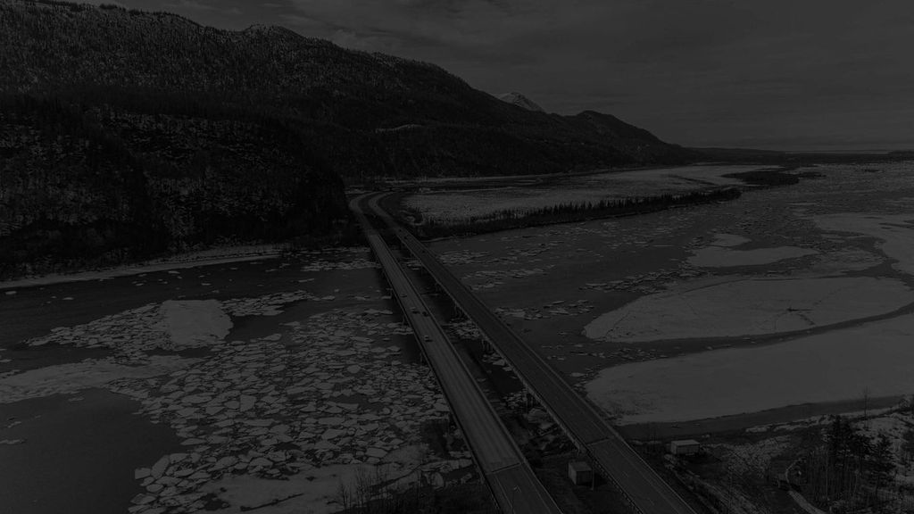 Professional flatbed tow truck on Alaska highway